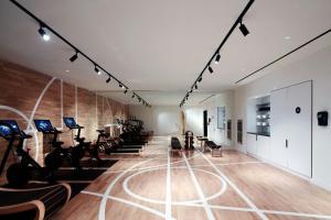 a gym with treadmills and elliptical machines at citizenM Seattle South Lake in Seattle