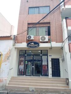 a building with a sign on the front of it at Apartamentos Erica 303 en el Centro histórico de Santa Marta in Santa Marta