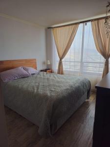 Ένα ή περισσότερα κρεβάτια σε δωμάτιο στο Departamento Tamarugal