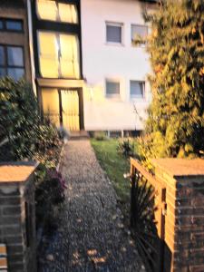 a walkway in front of a house with a building at Fmi35 in Rüsselsheim