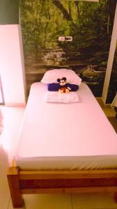 Postel nebo postele na pokoji v ubytování Apartahotel Arcoiris