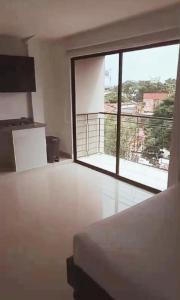 Postel nebo postele na pokoji v ubytování Apartahotel Arcoiris