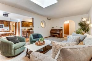 a living room with couches and a piano at 4 Mi to Capitol Spacious Springfield Home with Deck in Springfield