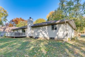 a small white house with a porch at 4 Mi to Capitol Spacious Springfield Home with Deck in Springfield