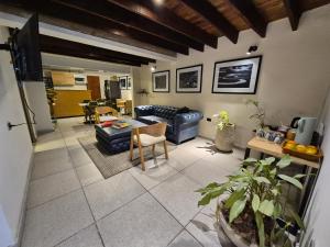 a living room with a couch and a table at Pepe's House Usaquén Bogotá - Small Hotel in Bogotá