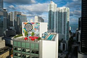 a mural on the side of a building in a city at citizenM Miami Brickell in Miami