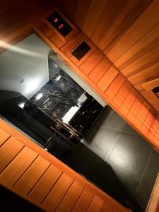 an overhead view of a stove top oven in a kitchen at La home Gold Jacuzzi in Seraing