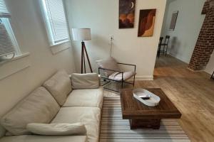 a living room with a couch and a coffee table at Fully Furnished Monthly Stay or Weekend Getaway in Hot Springs