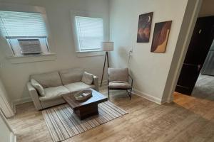 a living room with a couch and a table at Fully Furnished Monthly Stay or Weekend Getaway in Hot Springs