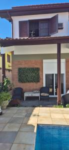 Bazén v ubytování Seu cantinho a dois quarteirões da Praia nebo v jeho okolí