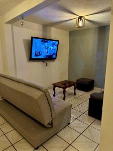 TV a/nebo společenská místnost v ubytování La casa de los abuelitos, lugar acogedor y mágico