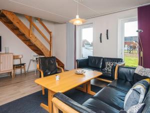 a living room with a couch and a table at 6 person holiday home in Rømø in Rømø Kirkeby +38 photos