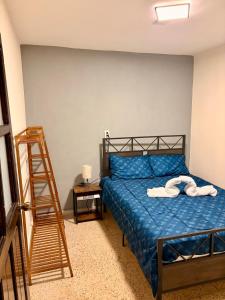 Postel nebo postele na pokoji v ubytování La casa de los abuelitos, lugar acogedor y mágico