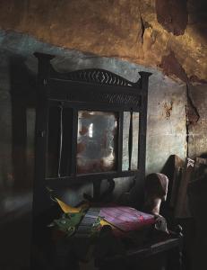 a wooden bed in a room with a window at YMCA Girls Hostel, Mall Road, Lahore in Lahore