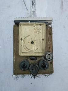 an old clock is hanging on a wall at YMCA Girls Hostel, Mall Road, Lahore in Lahore