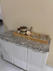 a kitchen counter with a tray of food on it at Casa de Temporada em Tianguá in Tianguá