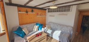 a living room with a couch and a table at SnowGranada Los Valles Daniela House in Monachil