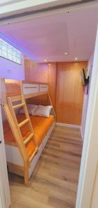 a small room with two bunk beds in it at SnowGranada Los Valles Daniela House in Monachil +11 photos