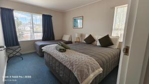 Postel nebo postele na pokoji v ubytování Chanel Court Motel