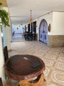 a room with a wooden table and a door at Finca Hotel Villa Nieves in Tuluá +22 photos