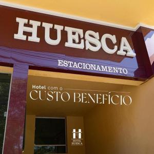 a huessen sign on the side of a building at Hotel Palace Huesca in Presidente Prudente +29 photos