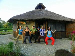 a group of people standing in front of a hut at Ecopark Homestay in Bharatpur +18 photos
