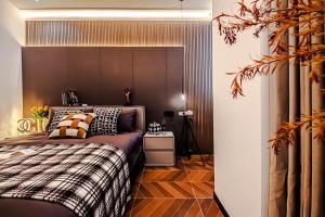 a bedroom with a bed and a wooden floor at Shanghai Hills&Rais Apartment - 100-inch Projector - Near Nanjing Road Pedestrian Street in Shanghai