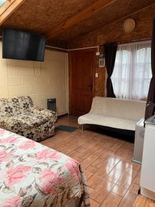 Ένα ή περισσότερα κρεβάτια σε δωμάτιο στο Cabaña El Tata