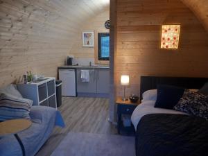 a living room with a couch and a kitchen at Mountain View in Tipperary