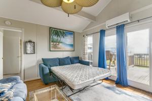 a living room with a bed and a couch at Ocean Views Second-Row Surfside Beach House in Surfside Beach