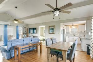 a living room with a table and blue chairs at Ocean Views Second-Row Surfside Beach House in Surfside Beach