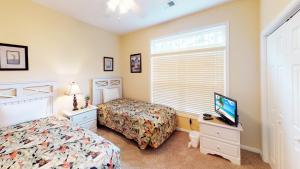 Ένα ή περισσότερα κρεβάτια σε δωμάτιο στο Village at the Glens S 205