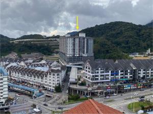 an aerial view of a city with buildings and roads at Jo’s Place Cameron Highlands EA922 in Brinchang