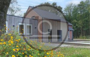 a house with a mirror in front of it at Stunning Home In Afferden in Afferden +2 photos