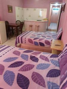 En eller flere senge i et værelse på Hotel Diana cazadora