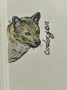a painting of a cat on a wall at Casa Prado Centro in Medellín