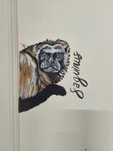 a drawing of a monkey on a wall at Casa Prado Centro in Medellín