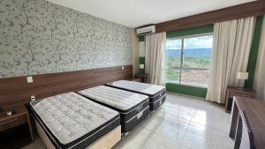 En eller flere senge i et værelse på Apartamentos Ecologic Ville + 31 billeder