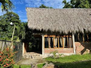 a small house with a thatched roof at Fhergoshouse in Rivas