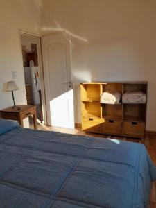 Ένα ή περισσότερα κρεβάτια σε δωμάτιο στο Cabañas Los Teros