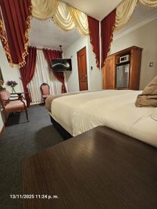 Una cama o camas en una habitación de Gya Hoteles