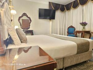 Una cama o camas en una habitación de Gya Hoteles