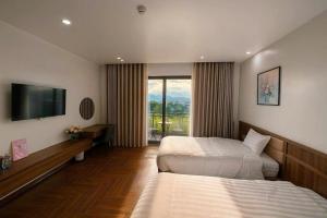 Ένα ή περισσότερα κρεβάτια σε δωμάτιο στο Luxury 88 Hotel