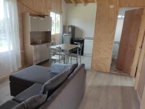 a living room with a couch and a table at Princesa in Puerto Montt