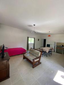 a living room with a couch and a table at Caminito 1 in Villa Anizacate
