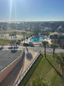 a tennis court at a resort with a tennis court at Sea Turtle Bungalow in Ormond Beach