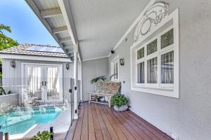 a house with a deck and a swimming pool at Merewether House 1910 - Iconic and Luxury Home in Merewether