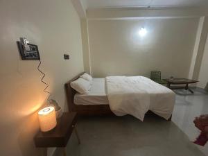 Ένα ή περισσότερα κρεβάτια σε δωμάτιο στο Janaa Residence