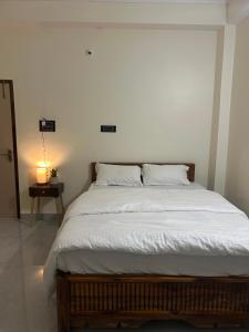 Ένα ή περισσότερα κρεβάτια σε δωμάτιο στο Janaa Residence