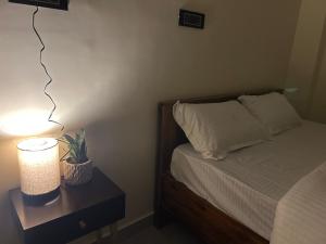 Ένα ή περισσότερα κρεβάτια σε δωμάτιο στο Janaa Residence